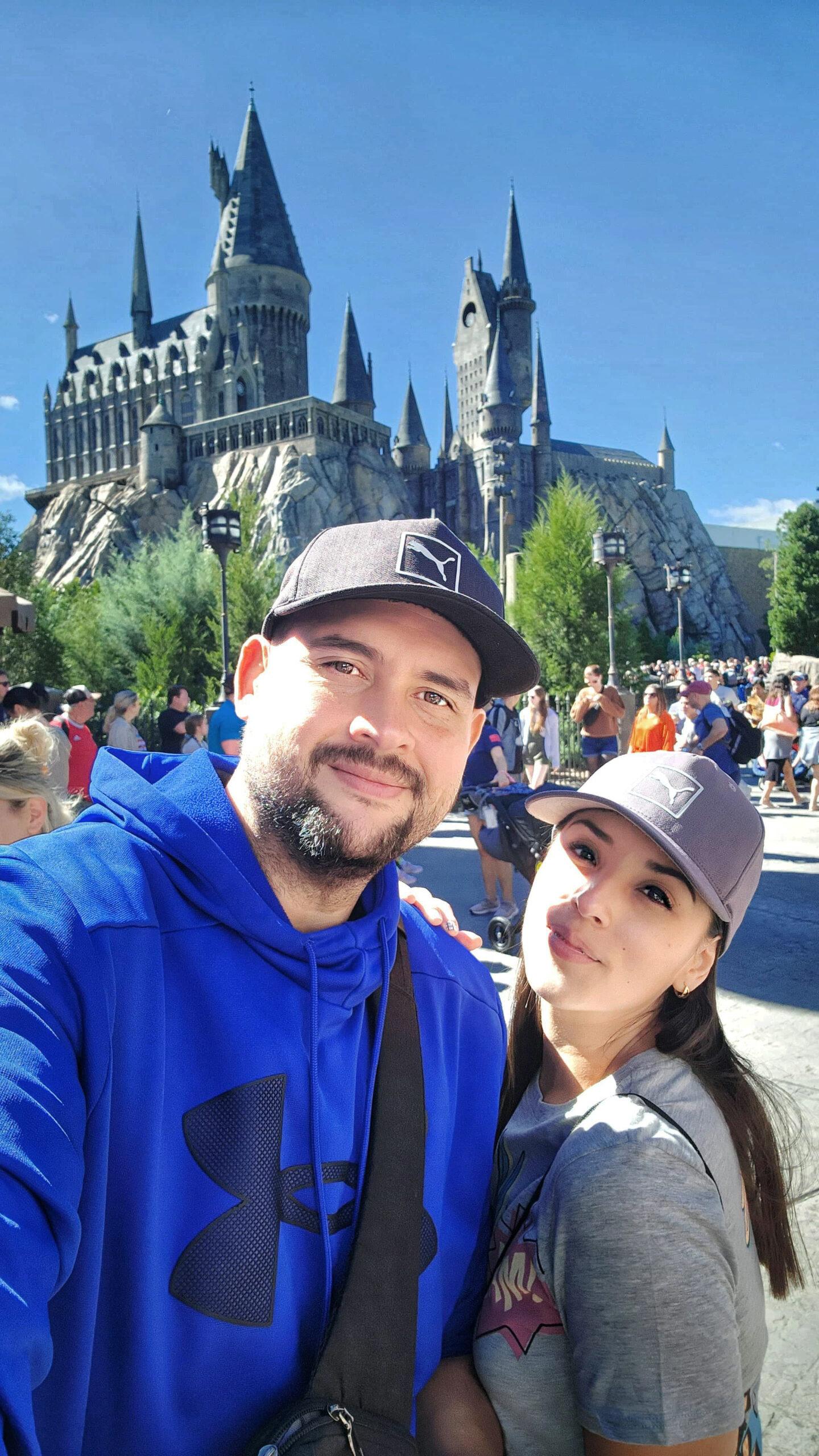 Couple selfie at fairytale castle theme park on a sunny magical day
