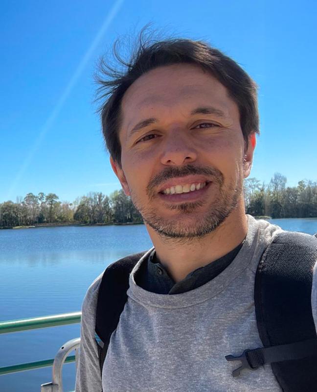 Smiling Man By Lake