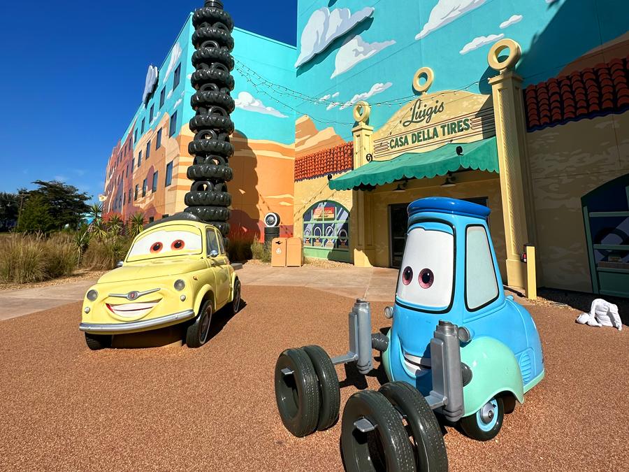 Disney Plus Disney World discount — Cars-themed courtyard at Disney’s Art of Animation Resort with Luigi’s Casa Della Tires and Luigi & Guido statues